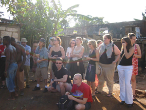 A large group of students and native Cubans standing outside.